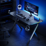 Escritorio para juegos NanoRS, negro, con soporte para auriculares y tazas, retroiluminación RGB, max. 75kg, dimensiones 1200x600x750mm, RS102